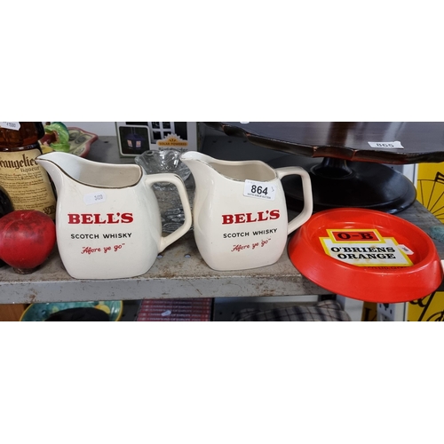 864 - Two vintage Wade PDM advertising ceramic jugs for Bell's Scotch Whisky with the slogan ''Afore Ye Go... 