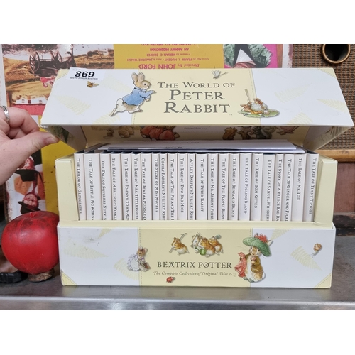 869 - A complete set of 23 children's books from The World of Peter Rabbit series by Beatrix Potter. Held ... 