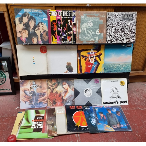 871 - A mixed selection of vintage vinyl records. Including some great albums by artists such as The Rolli... 