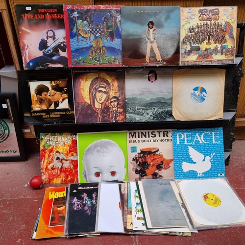 880 - A large number of vintage vinyl records. Including artists such as Thin Lizzy, Marvin Gaye, Procul H... 