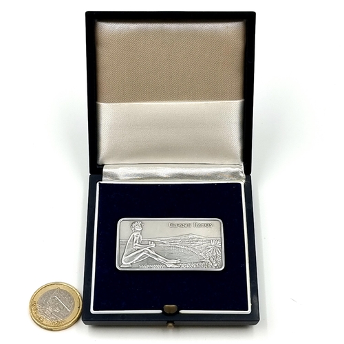 896 - A one ounce fine silver .999 ingot, depicting the Italian village of Giardini of Naxos. Encased in i... 