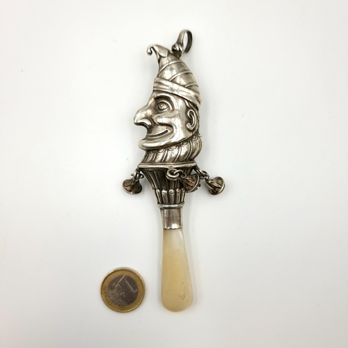 897 - A very unusual Victorian sterling silver Mr Punch rattle and bell, featuring a shimmering Mother of ... 