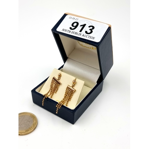 913 - A pair of 9 carat gold tassel drop stud earrings, set with butterfly backs. Weight: 1.92 grams.