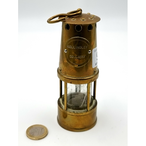 930 - A vintage  Kellingley Colliery brass miners lamp. A heavy quality piece. SD to glass insert.