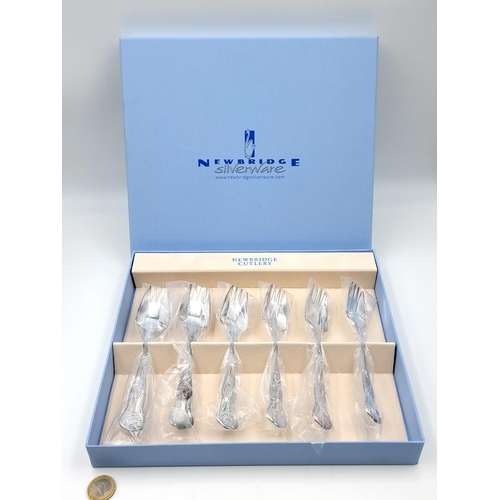 936 - A set of six Newbridge Cutlery silver plated forks/splaydes with ornate handles. In as new condition... 