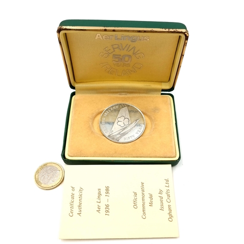 937 - Star Lot: An official Irish sterling silver (31.4g) commemorative Aer Lingus medal celebrating 50 ye... 