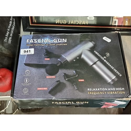 941 - A Fascial Massage Gun with four massage head types for deep tissue relaxation. In original box.