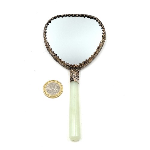 4 - A beautiful hand held Japanese vintage vanity mirror, set with a heart shaped silver metal framed bo... 