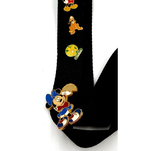 5 - A super cool Disney of Paris pin trading lanyard, featuring mickey mouse to centre and seven Disney ... 