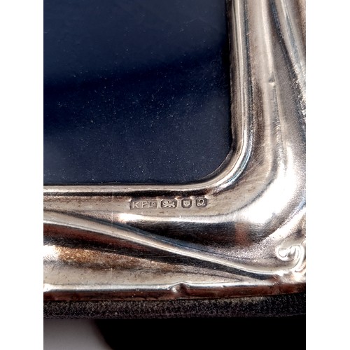 8 - A fine example of a sterling silver glazed photo frame, featuring a velvet reverse and pretty scroll... 