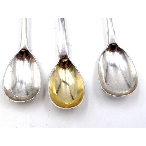 19 - A collection of three sterling silver cruet spoons, featuring one example set with a gilded bowl. Th... 