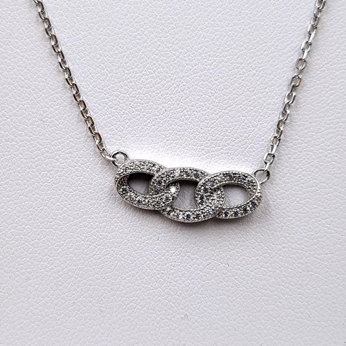 21 - A boxed sterling silver three ring pendant necklace, length of chain: 40cm. Together with a matching... 