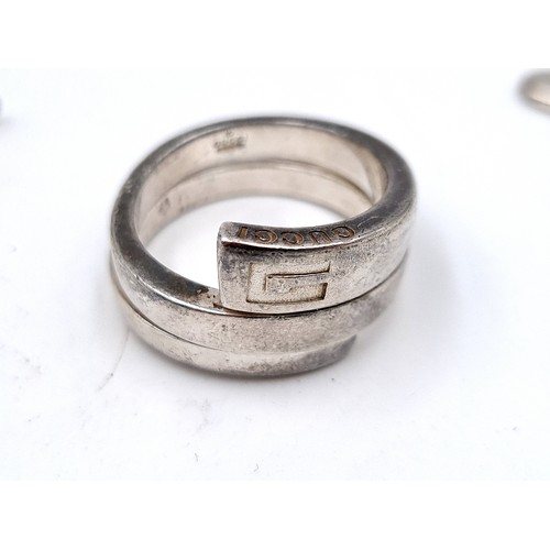 25 - A gentleman's sterling silver ring. Ring size: U. Together with a designer John Rocha sterling silve... 