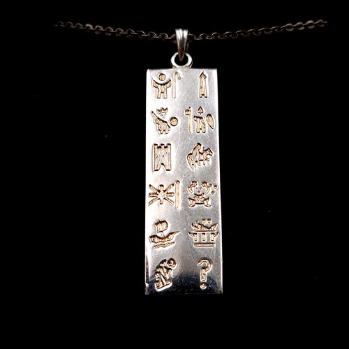 28 - An interesting sterling silver Ingot and chain, Ingot is set with Hieroglyphic markings. Length of c... 