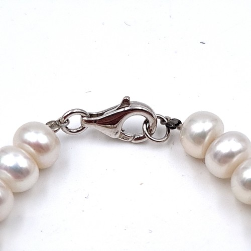 45 - A very pretty example of a natural fresh water Pearl bracelet, featuring  a sterling silver Lobster ... 