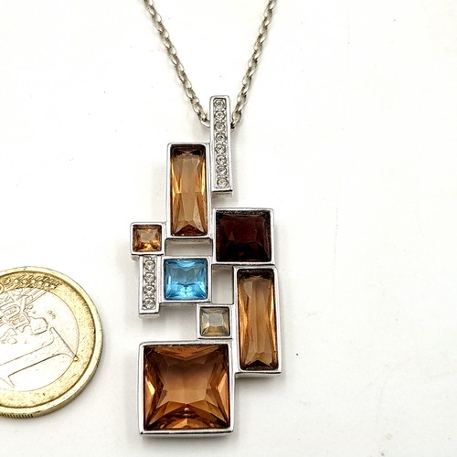 51 - An unusual stacked sterling silver step mounted gem set pendant and chain. Length: 44cm. Weight: 16.... 