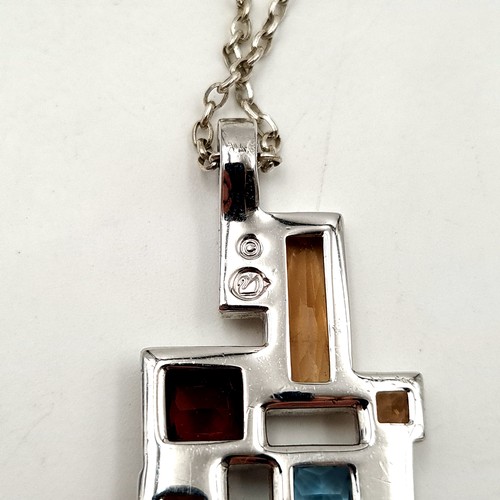 51 - An unusual stacked sterling silver step mounted gem set pendant and chain. Length: 44cm. Weight: 16.... 