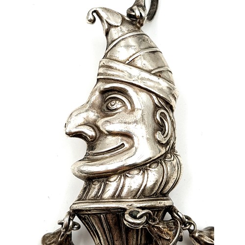 897 - A very unusual Victorian sterling silver Mr Punch rattle and bell, featuring a shimmering Mother of ... 