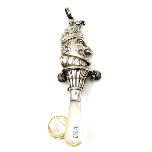 897 - A very unusual Victorian sterling silver Mr Punch rattle and bell, featuring a shimmering Mother of ... 