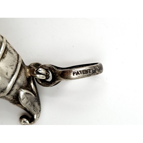 897 - A very unusual Victorian sterling silver Mr Punch rattle and bell, featuring a shimmering Mother of ... 