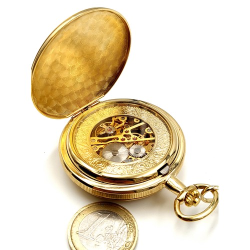 902 - A bright gilded coloured Skelton pocket watch, featuring a marked cartouche to front and featuring a... 