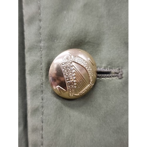 138 - Star Lot : A wonderfully detailed Irish Military rain jacket with fabulous harp buttons to front, hi... 