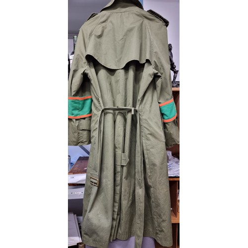 138 - Star Lot : A wonderfully detailed Irish Military rain jacket with fabulous harp buttons to front, hi... 