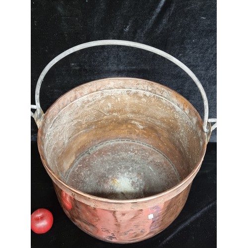 202 - Star Lot A fabulous huge antique hand hammered copper cauldron of French origin. With an iron handle... 