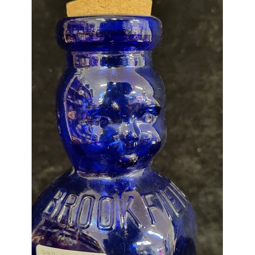 228 - A vintage one quart cobalt blue bottle reading 'Brookfield Baby Top' with a neck in the form of a ba... 