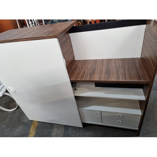 854 - A very interesting cool pull-out desk/cabinet with a section containing three shelves, a stationary ... 