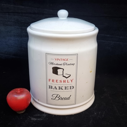 129 - A large heavy ceramic bread bin complete with lid and 