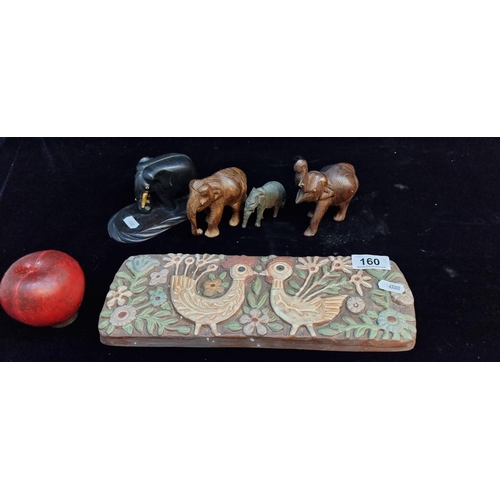 160 - A lot of five vintage collectables including four carved African wooden figures and a terracotta wal... 