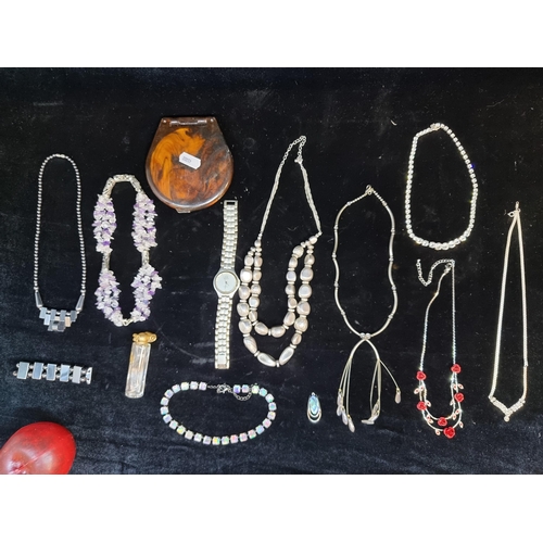 170 - A selection of costume jewellery including multiple necklaces and a fax tortoise shell vintage compa... 