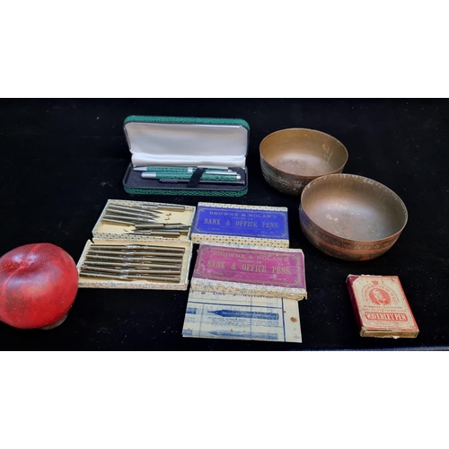 203 - A mixed lot of six items including a pair of brass tea bowls and three boxes of vintage fountain pen... 