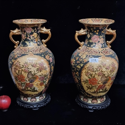 218 - A beautiful pair of large Chinese cloisonné vases featuring a bird motif and gilt handles. In good c... 