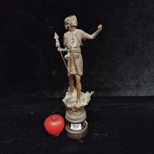 220 - A large vintage spelter figure of a man with a spade titled 'Le Pecheur'. Held on an ebonised wooden... 