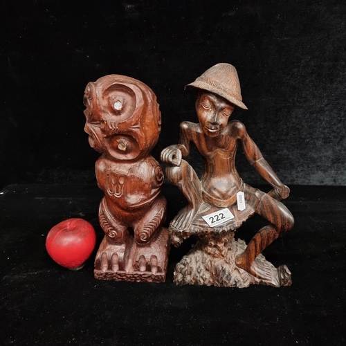 222 - Two hardwood handcarved sculptures including a New Zealand Kauri example depicting an abstract figur... 