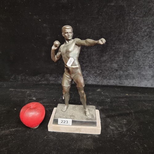 223 - A vintage heavy bronze  figure of a shot put athlete. Held on a marble base. A really well cast piec... 