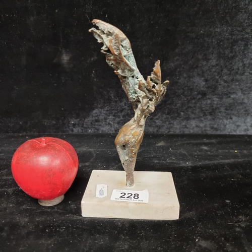 228 - Star Lot: An abstract bronze figure of organic form. Features attractive verdigris. Held on a marble... 