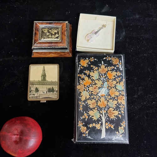 240 - Four items including a mother of pearl pin in the form of a violin, a wooden jewellery box, a brass ... 