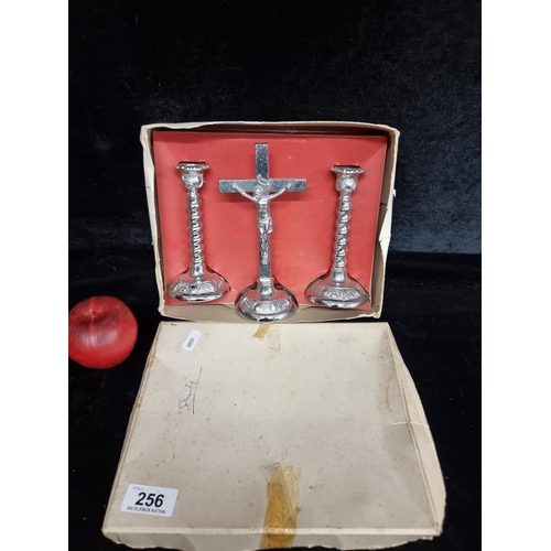 256 - A vintage box containing a vintage Zimco Crucifix set consisting of a chrome church alter cross alon... 