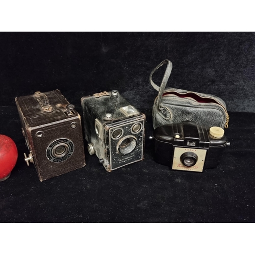 267 - Three vintage cameras including two Kodak 'Brownie' models Six-20 C and 127 with case. Along with a ... 