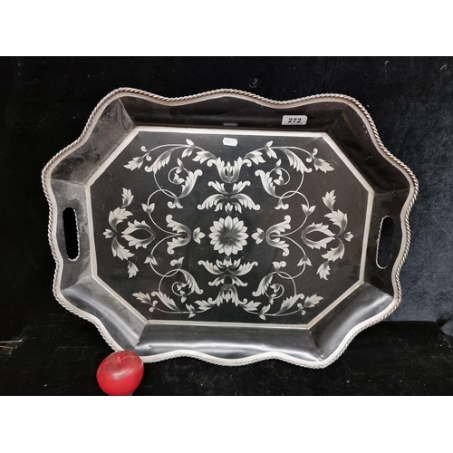 272 - An ornate vintage large metal serving tray with bun feet.