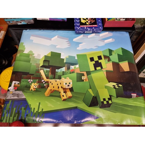 258 - A large selection of Minecraft items including eleven guide books, tin boxes with more guides, stick... 