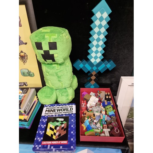 258 - A large selection of Minecraft items including eleven guide books, tin boxes with more guides, stick... 