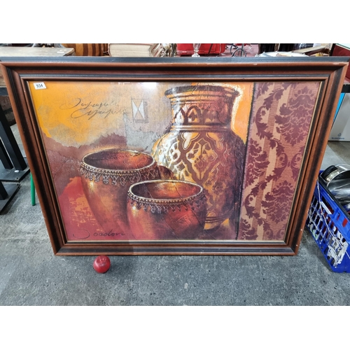 934 - A very large framed print depicting Moroccan style pots and vases.