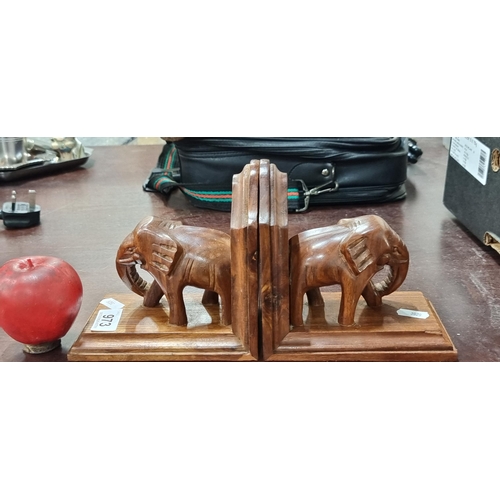 973 - A pair of lovely carved rosewood elephant bookends.