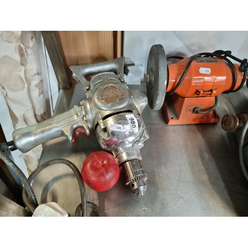 980 - A vintage Wolf branded electric drill. Double insulated. Along with a Heilsen bench grinder (150W)