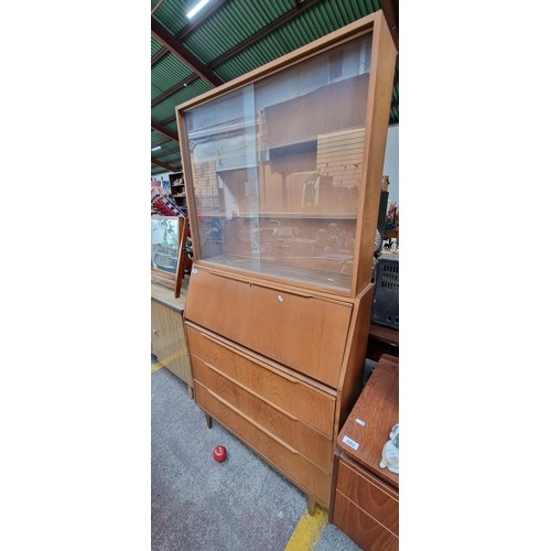 984 - Star Lot : A fabulous vintage Mid Century teak dresser with three full length drawers to base, a fol... 