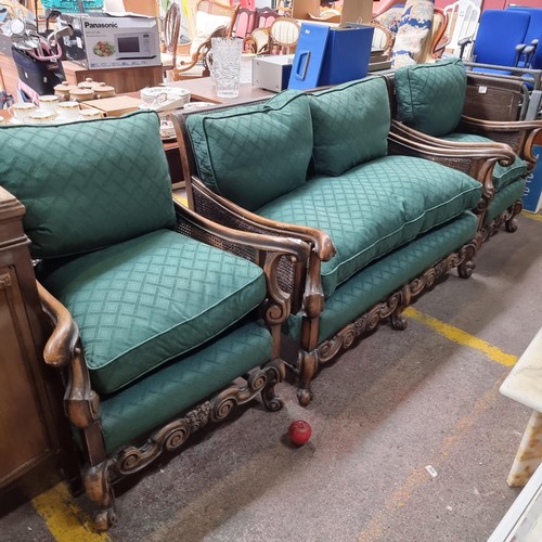 985 - Star lot : A fabulous antique bergere rattan three piece suite consisting of two fauteuils / armchai... 